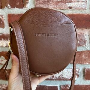 Portland Leather Goods Small Circle Crossbody Bag in Mondelo Brandy Color